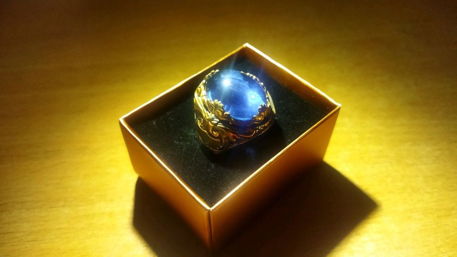 Фото №1 к отзыву покупателя Sakaido о товаре Перстень серебро 925 с позолотой 14к: синий гладкий овальный камень