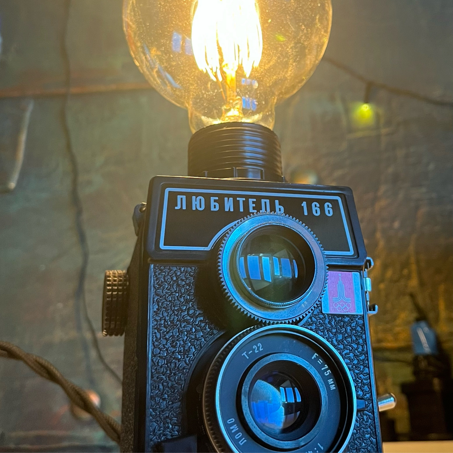Photo №1 к отзыву покупателя Nava Kurosaki о товаре Светильник из олимпийского фотоаппарата в подарочном ящике