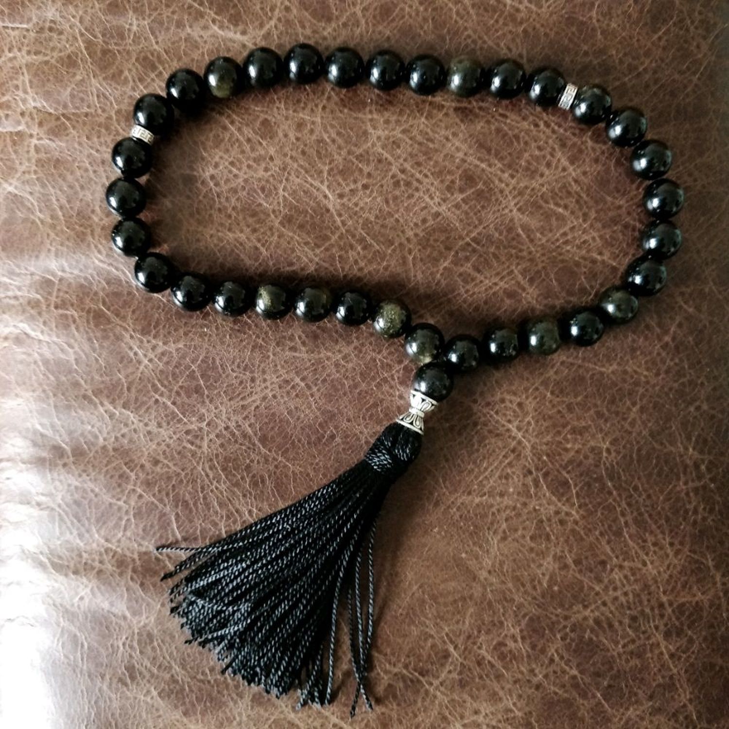 Фото №1 к отзыву покупателя Мартыненко Давид о товаре Rosary made of golden obsidian 33 beads and 925 sterling silver
