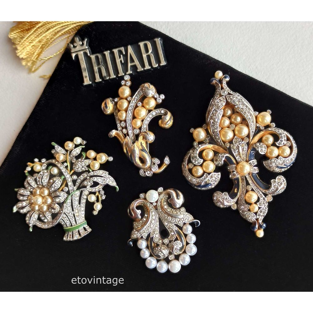 Lot - Trifari Empress Eugenie dangle pin clip and earrings with gold wash,  navy enamel, rhinestones, and faux pearls.